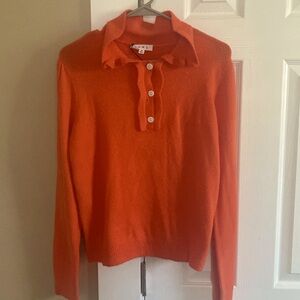 Orange collared sweater.
